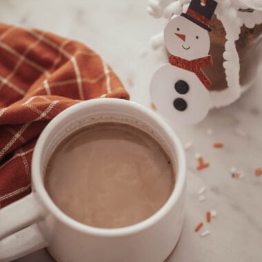 A cup of hot cocoa beside our homemade hot cocoa mix