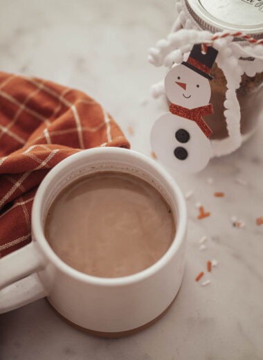 A cup of hot cocoa beside our homemade hot cocoa mix